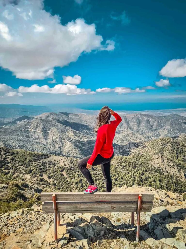 hiker admiring the ocean vista on a trail in cyprus